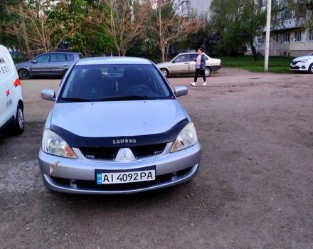 Серый Мицубиси Лансер, объемом двигателя 1.6 л и пробегом 302 тыс. км за 3200 $, фото 1 на Automoto.ua