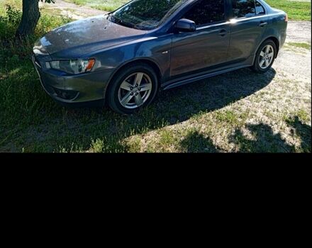 Серый Мицубиси Лансер, объемом двигателя 2 л и пробегом 244 тыс. км за 7000 $, фото 1 на Automoto.ua