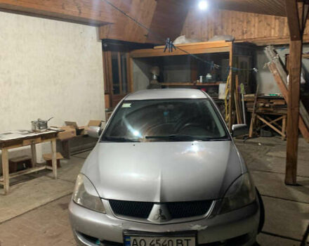 Сірий Міцубісі Lancer, об'ємом двигуна 1.58 л та пробігом 320 тис. км за 4000 $, фото 1 на Automoto.ua
