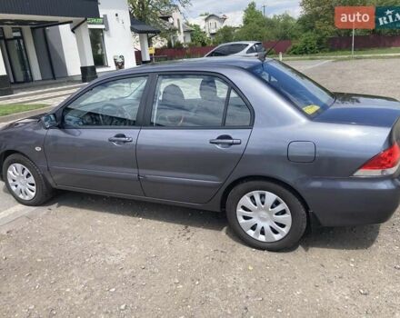 Серый Мицубиси Лансер, объемом двигателя 1.59 л и пробегом 44 тыс. км за 6200 $, фото 1 на Automoto.ua