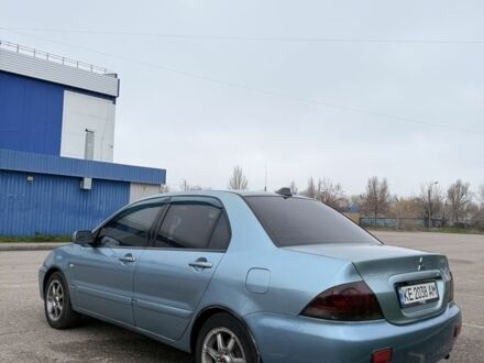 Серый Мицубиси Лансер, объемом двигателя 1.6 л и пробегом 238 тыс. км за 4300 $, фото 1 на Automoto.ua