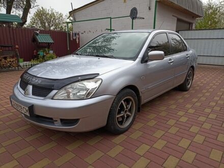 Сірий Міцубісі Lancer, об'ємом двигуна 1.6 л та пробігом 206 тис. км за 5100 $, фото 1 на Automoto.ua