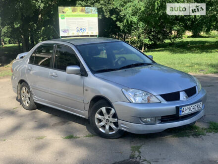 Сірий Міцубісі Lancer, об'ємом двигуна 1.6 л та пробігом 244 тис. км за 5200 $, фото 1 на Automoto.ua