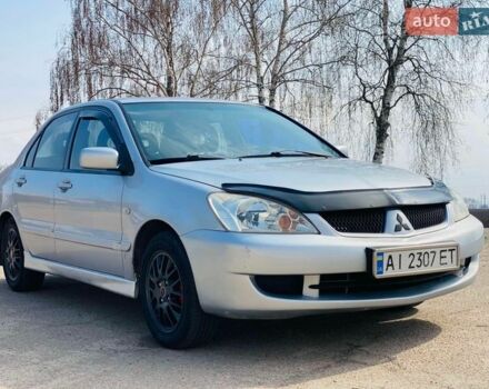 Серый Мицубиси Лансер, объемом двигателя 1.58 л и пробегом 369 тыс. км за 2600 $, фото 1 на Automoto.ua