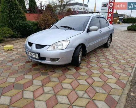 Серый Мицубиси Лансер, объемом двигателя 1.6 л и пробегом 268 тыс. км за 2900 $, фото 1 на Automoto.ua