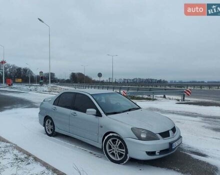 Серый Мицубиси Лансер, объемом двигателя 2 л и пробегом 253 тыс. км за 4200 $, фото 1 на Automoto.ua
