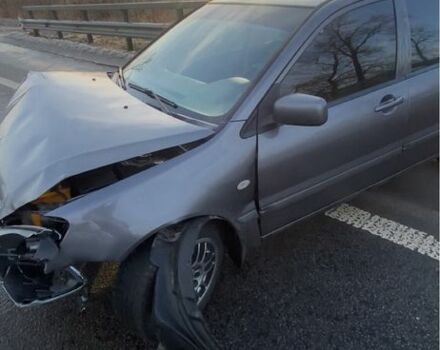 Серый Мицубиси Лансер, объемом двигателя 1.6 л и пробегом 191 тыс. км за 2000 $, фото 1 на Automoto.ua