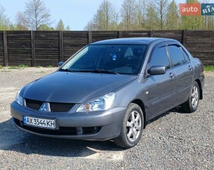 Сірий Міцубісі Lancer, об'ємом двигуна 1.58 л та пробігом 260 тис. км за 4000 $, фото 1 на Automoto.ua