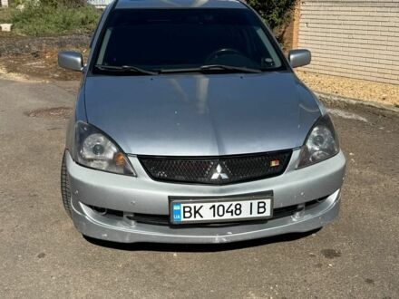 Серый Мицубиси Лансер, объемом двигателя 2 л и пробегом 231 тыс. км за 4500 $, фото 1 на Automoto.ua