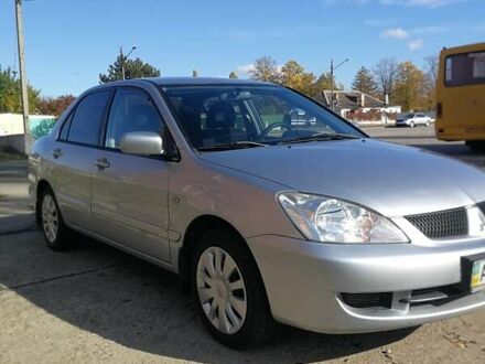 Серый Мицубиси Лансер, объемом двигателя 1.6 л и пробегом 142 тыс. км за 4700 $, фото 1 на Automoto.ua