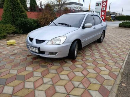 Серый Мицубиси Лансер, объемом двигателя 1.6 л и пробегом 238 тыс. км за 2900 $, фото 1 на Automoto.ua