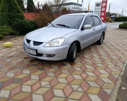 Серый Мицубиси Лансер, объемом двигателя 1.6 л и пробегом 238 тыс. км за 2900 $, фото 1 на Automoto.ua