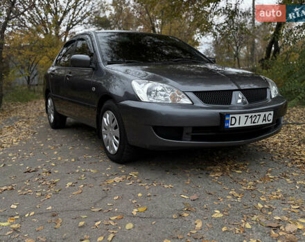 Сірий Міцубісі Lancer, об'ємом двигуна 1.58 л та пробігом 247 тис. км за 4900 $, фото 1 на Automoto.ua