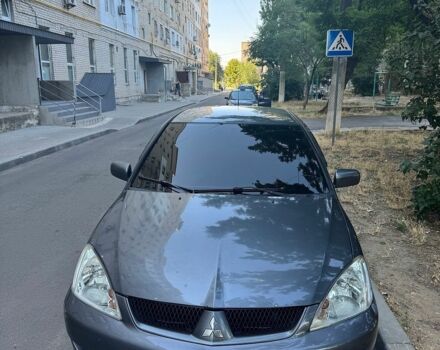 Серый Мицубиси Лансер, объемом двигателя 1.58 л и пробегом 250 тыс. км за 4500 $, фото 1 на Automoto.ua