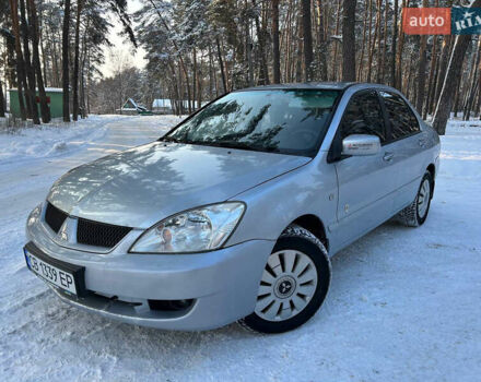 Серый Мицубиси Лансер, объемом двигателя 1.58 л и пробегом 240 тыс. км за 3750 $, фото 1 на Automoto.ua