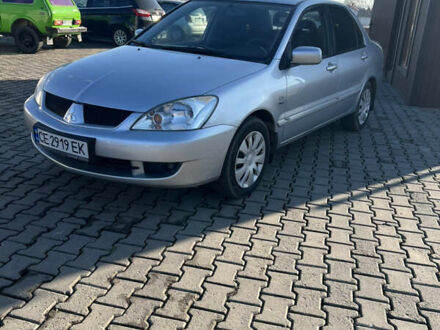 Серый Мицубиси Лансер, объемом двигателя 1.58 л и пробегом 178 тыс. км за 3300 $, фото 1 на Automoto.ua