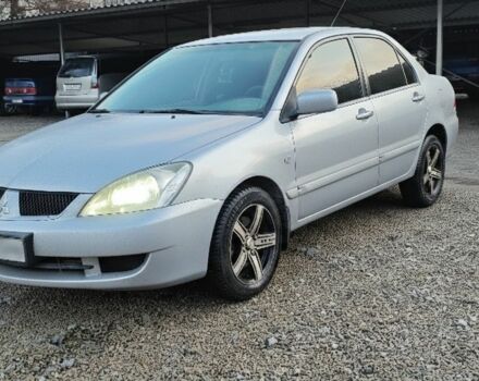 Серый Мицубиси Лансер, объемом двигателя 1.6 л и пробегом 199 тыс. км за 5000 $, фото 1 на Automoto.ua