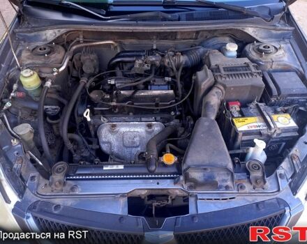 Серый Мицубиси Лансер, объемом двигателя 1.6 л и пробегом 225 тыс. км за 3200 $, фото 1 на Automoto.ua