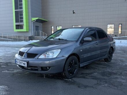 Серый Мицубиси Лансер, объемом двигателя 1.6 л и пробегом 160 тыс. км за 3700 $, фото 1 на Automoto.ua