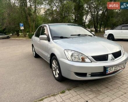 Серый Мицубиси Лансер, объемом двигателя 1.58 л и пробегом 250 тыс. км за 3999 $, фото 1 на Automoto.ua