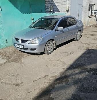 Серый Мицубиси Лансер, объемом двигателя 1.6 л и пробегом 183 тыс. км за 3500 $, фото 1 на Automoto.ua