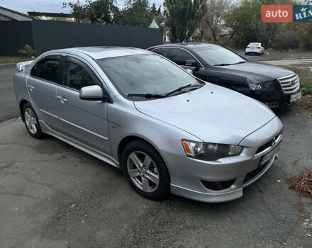 Серый Мицубиси Лансер, объемом двигателя 2 л и пробегом 230 тыс. км за 5500 $, фото 1 на Automoto.ua