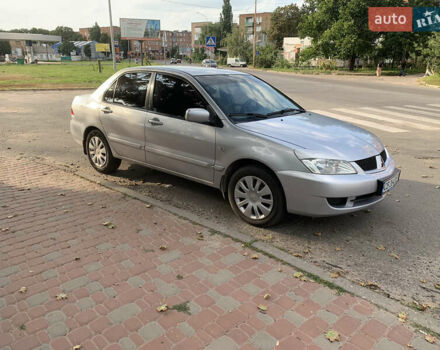 Серый Мицубиси Лансер, объемом двигателя 1.58 л и пробегом 258 тыс. км за 4000 $, фото 1 на Automoto.ua
