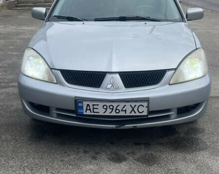 Серый Мицубиси Лансер, объемом двигателя 2 л и пробегом 230 тыс. км за 4000 $, фото 1 на Automoto.ua