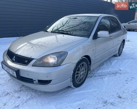 Серый Мицубиси Лансер, объемом двигателя 2 л и пробегом 185 тыс. км за 5900 $, фото 1 на Automoto.ua