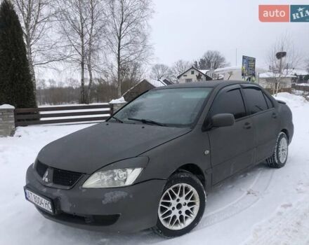 Серый Мицубиси Лансер, объемом двигателя 1.6 л и пробегом 320 тыс. км за 3999 $, фото 1 на Automoto.ua