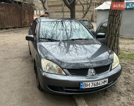 Серый Мицубиси Лансер, объемом двигателя 1.6 л и пробегом 203 тыс. км за 4200 $, фото 1 на Automoto.ua