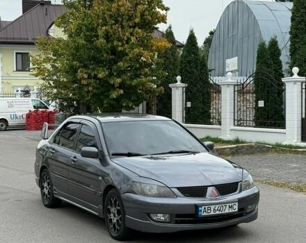 Серый Мицубиси Лансер, объемом двигателя 1.58 л и пробегом 295 тыс. км за 3350 $, фото 1 на Automoto.ua