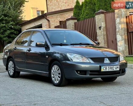 Сірий Міцубісі Lancer, об'ємом двигуна 1.6 л та пробігом 240 тис. км за 4950 $, фото 1 на Automoto.ua