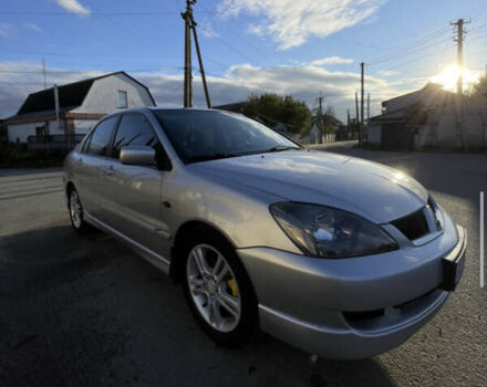 Серый Мицубиси Лансер, объемом двигателя 2 л и пробегом 182 тыс. км за 4999 $, фото 1 на Automoto.ua