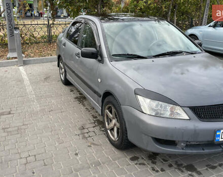 Серый Мицубиси Лансер, объемом двигателя 1.58 л и пробегом 200 тыс. км за 4500 $, фото 1 на Automoto.ua