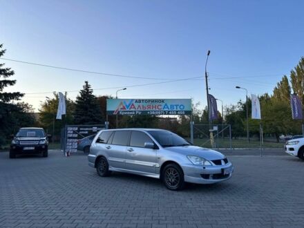 Серый Мицубиси Лансер, объемом двигателя 1.6 л и пробегом 203 тыс. км за 3500 $, фото 1 на Automoto.ua