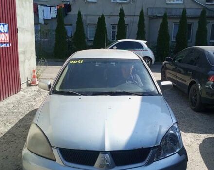 Серый Мицубиси Лансер, объемом двигателя 1.58 л и пробегом 500 тыс. км за 2100 $, фото 1 на Automoto.ua