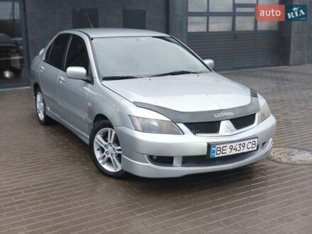 Серый Мицубиси Лансер, объемом двигателя 2 л и пробегом 230 тыс. км за 3650 $, фото 1 на Automoto.ua