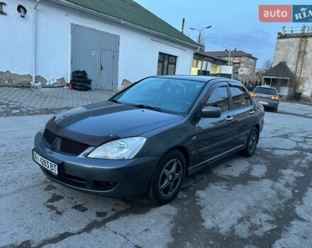 Серый Мицубиси Лансер, объемом двигателя 1.6 л и пробегом 230 тыс. км за 3999 $, фото 1 на Automoto.ua