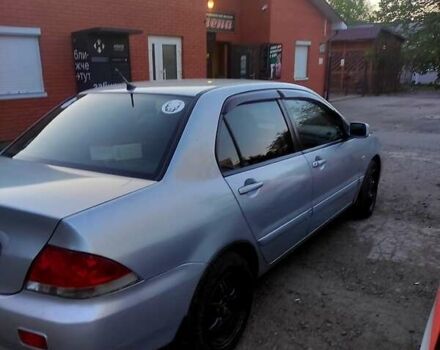 Сірий Міцубісі Lancer, об'ємом двигуна 1.6 л та пробігом 302 тис. км за 3200 $, фото 1 на Automoto.ua