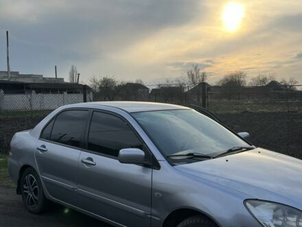 Сірий Міцубісі Lancer, об'ємом двигуна 1.6 л та пробігом 248 тис. км за 3000 $, фото 1 на Automoto.ua