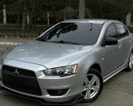 Серый Мицубиси Лансер, объемом двигателя 2 л и пробегом 199 тыс. км за 7000 $, фото 1 на Automoto.ua