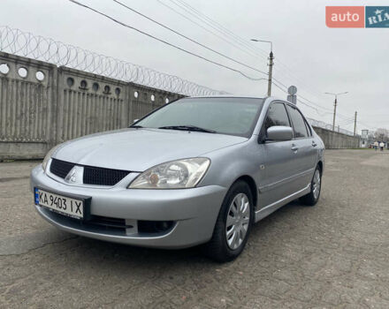 Серый Мицубиси Лансер, объемом двигателя 1.58 л и пробегом 240 тыс. км за 5500 $, фото 1 на Automoto.ua