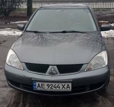 Сірий Міцубісі Lancer, об'ємом двигуна 1.58 л та пробігом 218 тис. км за 4700 $, фото 1 на Automoto.ua