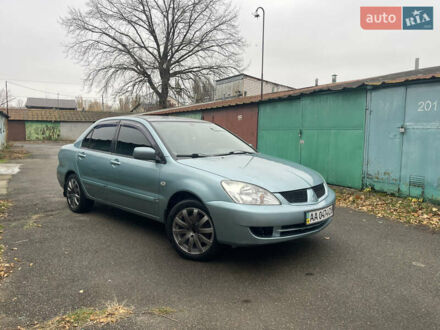 Серый Мицубиси Лансер, объемом двигателя 1.58 л и пробегом 205 тыс. км за 4750 $, фото 1 на Automoto.ua