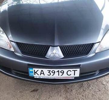 Серый Мицубиси Лансер, объемом двигателя 1.58 л и пробегом 400 тыс. км за 5000 $, фото 1 на Automoto.ua
