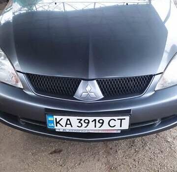 Серый Мицубиси Лансер, объемом двигателя 1.58 л и пробегом 400 тыс. км за 5000 $, фото 1 на Automoto.ua