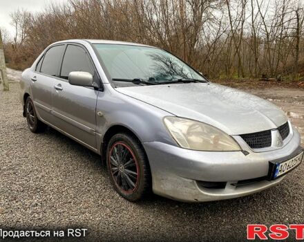 Серый Мицубиси Лансер, объемом двигателя 1.6 л и пробегом 224 тыс. км за 3200 $, фото 1 на Automoto.ua