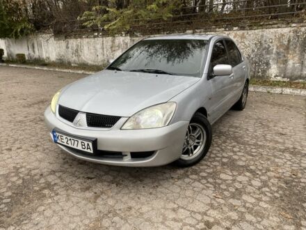 Серый Мицубиси Лансер, объемом двигателя 1.6 л и пробегом 380 тыс. км за 4000 $, фото 1 на Automoto.ua