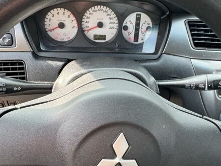 Серый Мицубиси Лансер, объемом двигателя 1.6 л и пробегом 129 тыс. км за 5000 $, фото 1 на Automoto.ua